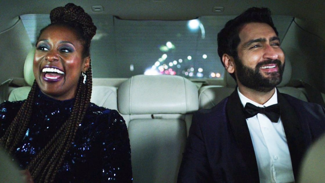 Issa Rae (left) and Kumail Nanjiani (right) in formal attire sitting in the back of a car.