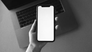Person holding iPhone.