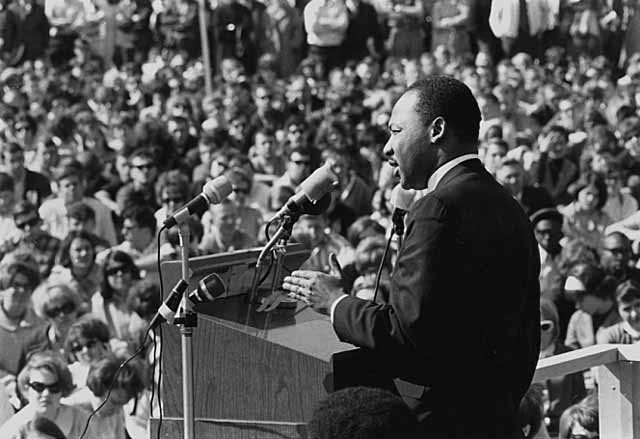 Martin Luther King Jr. is shown giving a speech