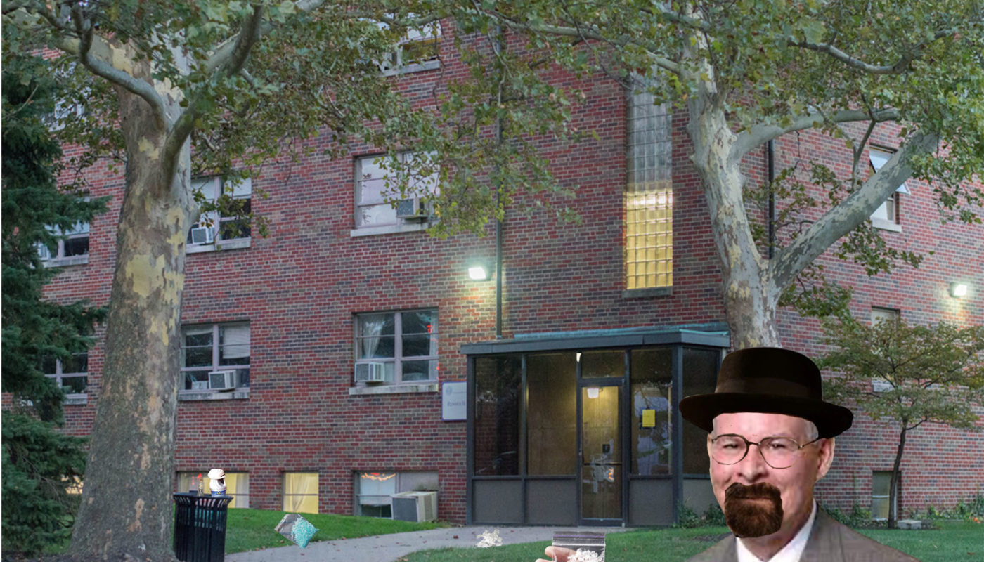 A Walter White lookalike is seen standing outside the Renner Hall meth lab with a bag of crstal meth.