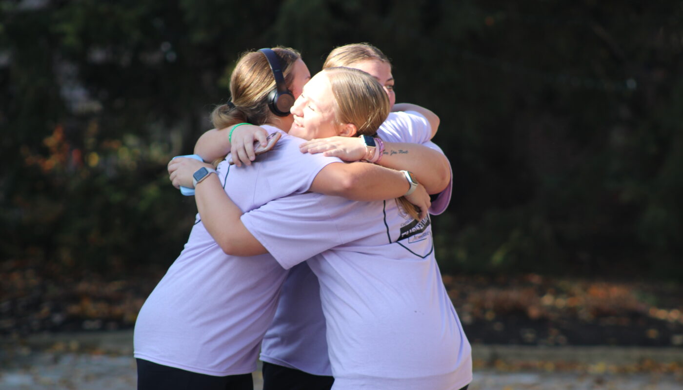 Student participants celebrating finishing at the end of the Turkey Trot. Photo by Riley Donovan.
